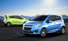 A green and a blue Chevy Spark